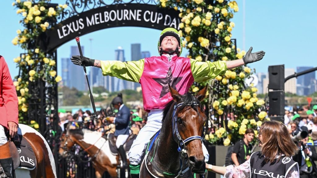 Robbie Dolan milking the applause at Flemington Racecourse after riding Knight's Choice to victory in the Melbourne Cup in 2024