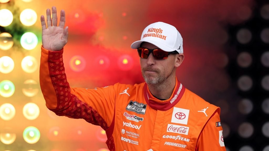 Toyota driver Denny Hamlin waving to fans before securing his place in the 2025 Nascar Cup Championship Race