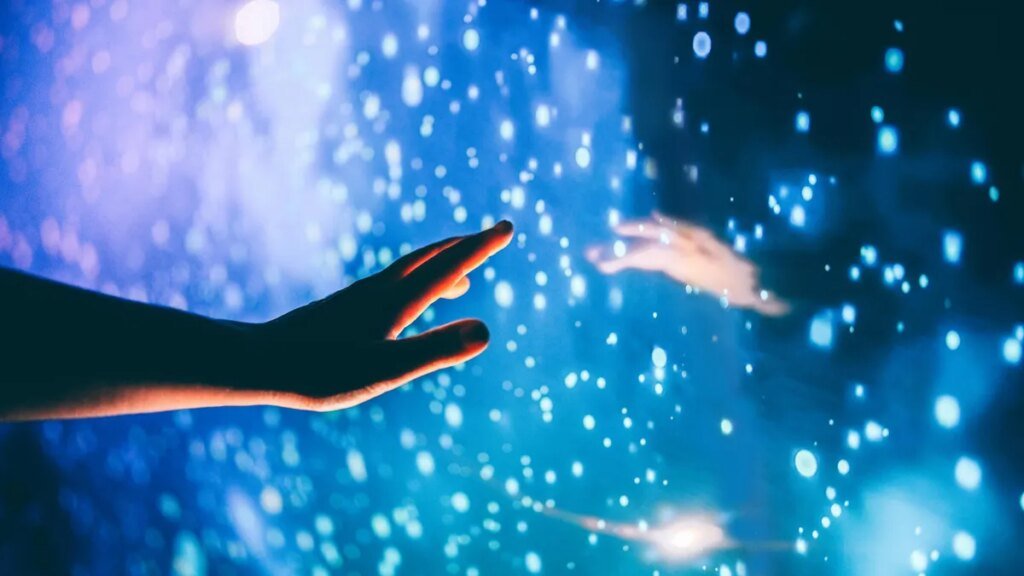 AI Is Sucking Meaning From Our Lives. There’s a Way to Get It Back A human hand reaching out to the dark unknown, the dark matter