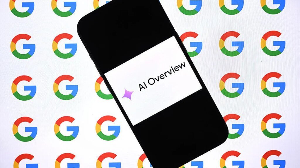 A cellphone with an image on it that reads AI Overview. The AI sparkle precedes the words.