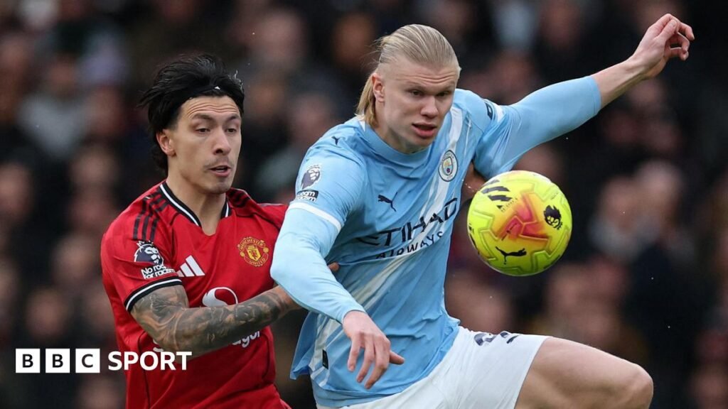 Lisandro Martinez and Erling Haaland fight for possession in the Manchester derby