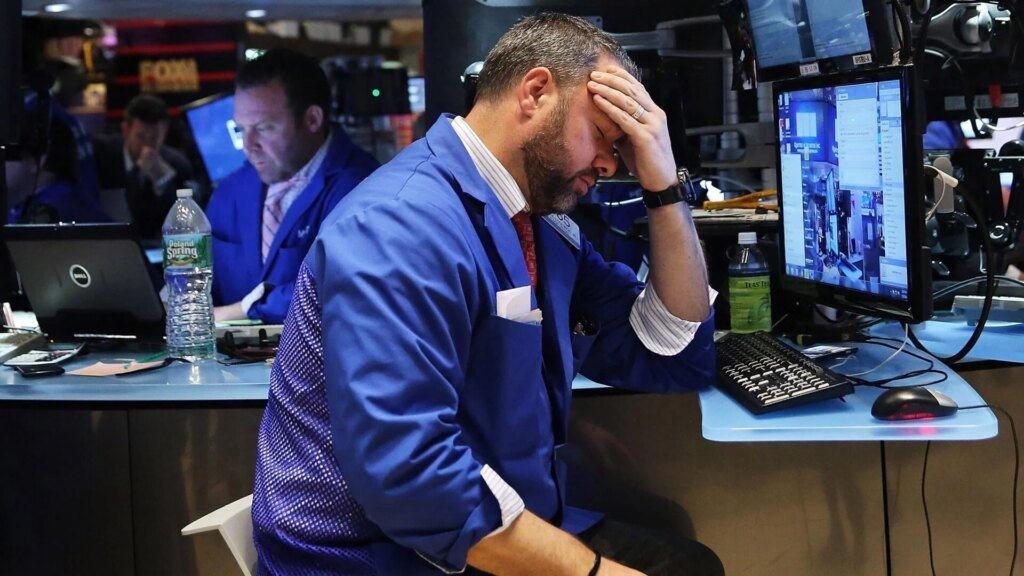 One of those photos of an NYSE floor trader during a bad day.