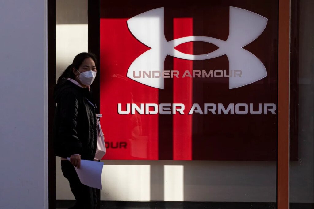 BEIJING, CHINA - JANUARY 09: A pedestrian walks past an Under Armour store on January 9, 2023 in Beijing, China. (Photo by VCG/VCG via Getty Images)