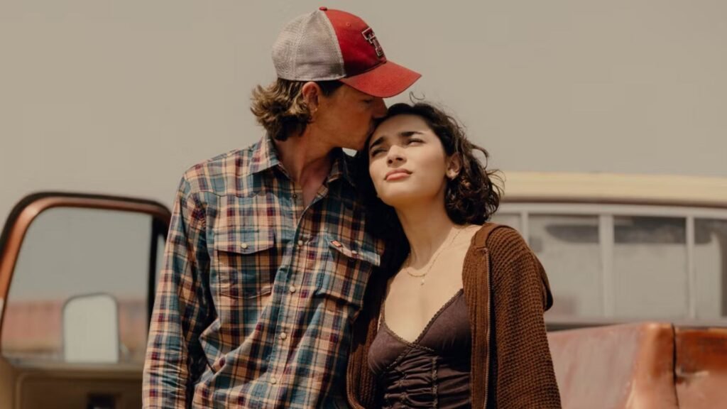 Cooper kisses Ariana on the forehead