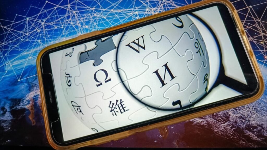 The Wikipedia logo displayed on a phone screen