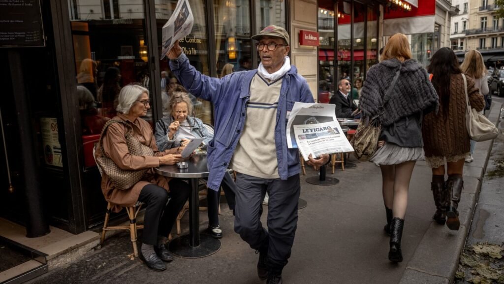 France honors last newspaper hawker in Paris with knighthood : NPR