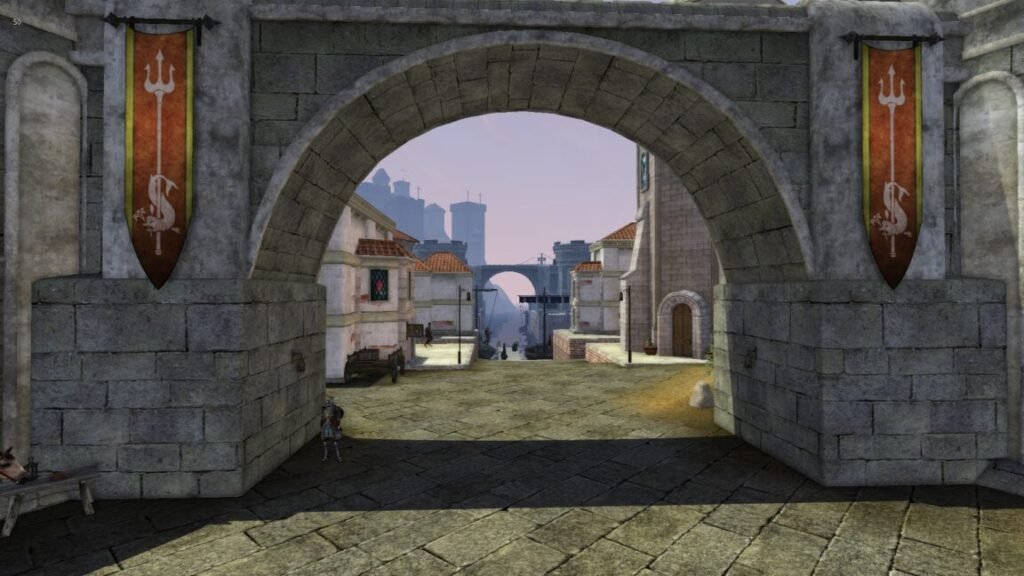 A stone gate to a city street