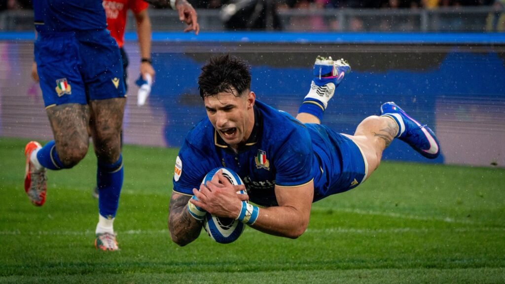 Tommaso Menoncello of Italy scoring a try during a Six Nations rugby match.