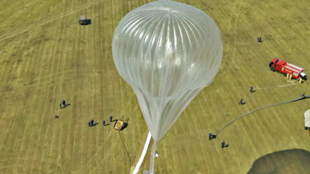 Russia turns to high altitude balloons after Starlink restrictions disrupt battlefield communications across Russian-controlled territories A Russian high-altitude stratospheric balloon is being prepared for launch in an open field, with ground crew and support vehicles positioned nearby.