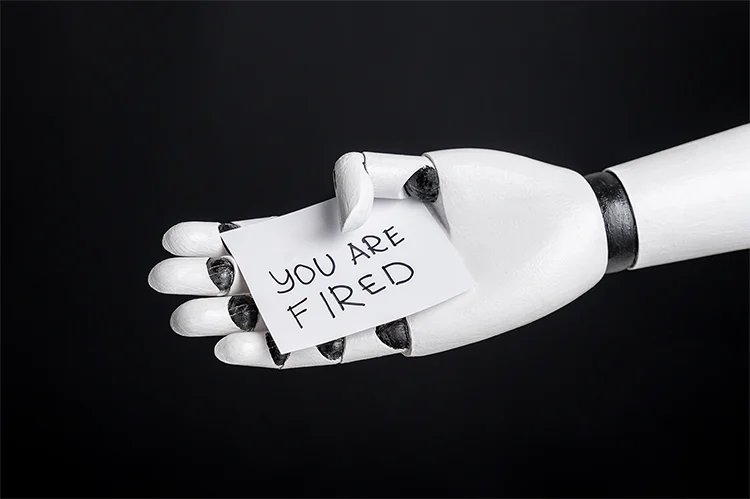There’s a New Term for Workers Freaking Out Over Being Replaced by AI Robotic Hand Holding Sign "you Are Fired"