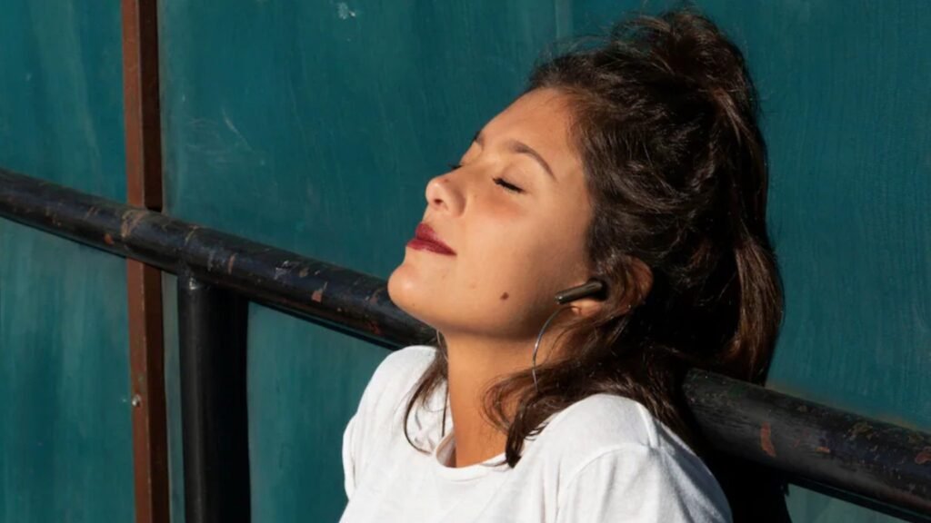 These affordable noise-cancelling earbuds just got even cheaper with $50 OFF at Best Buy Person wearing JBL Tune 245NC earbuds