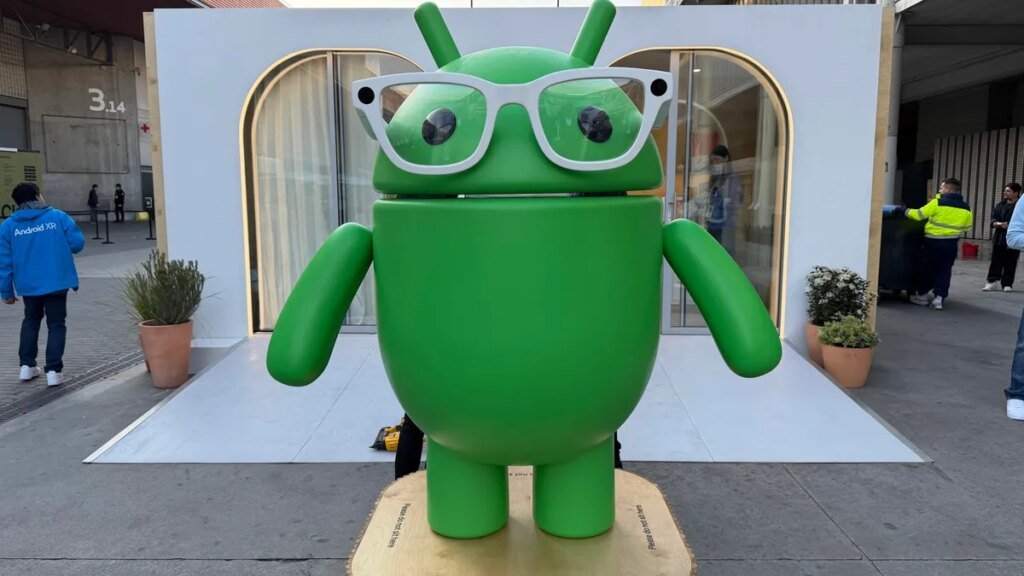 Smart Glasses, AI Wardrobes and Cute Bots: Stroll Down Android Avenue at MWC 2026 A green Android bot figure with smart glasses