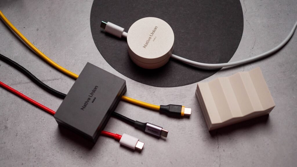 I used a $30 cable weight, and it is now my favorite desk accessory