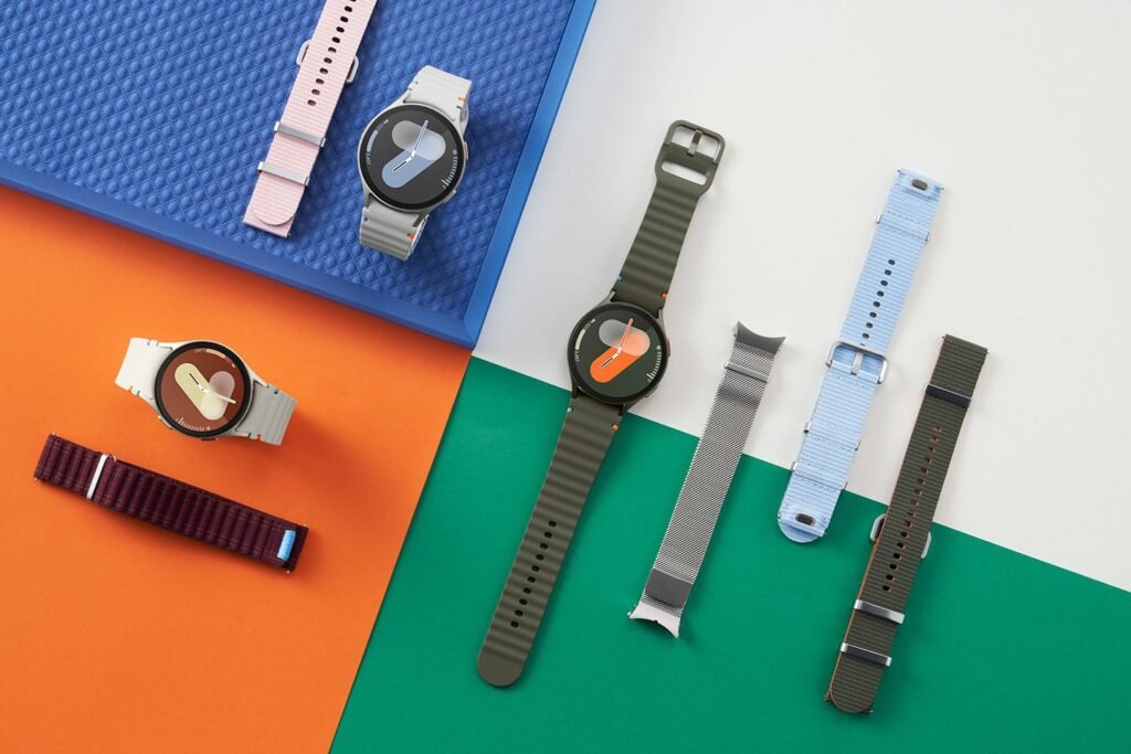 The Best Buy Memorial Day sale chops $50 OFF the price of the Samsung Galaxy Watch 7 Samsung Galaxy Watch 7s of various colors on orange, green, blue and white backgrounds