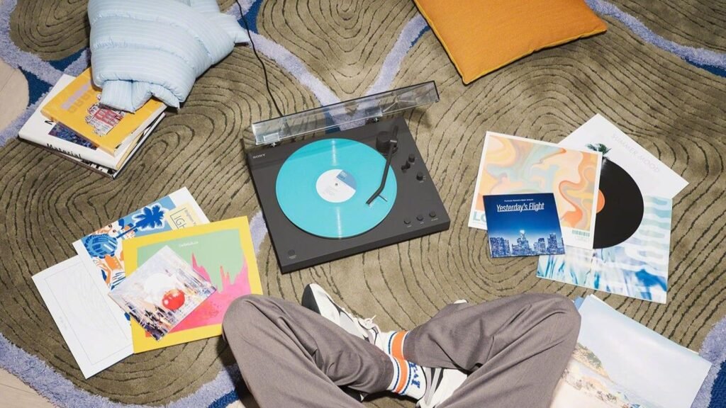 The Sony PS-LX3BT with vinyl records scattered across the floor