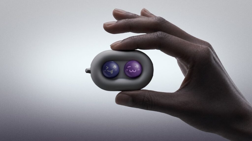 DuRoBo’s Moodi just brought competition to Boox’s weirdest accessory The DuRoBo Moodi in a model's hand, showing off its cute purple and pink emoji caps.
