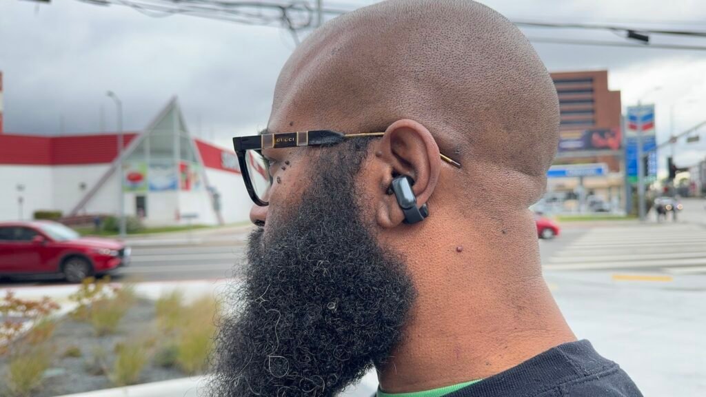 The best open-ear earbuds just dropped 33% back to their lowest price EVER at Amazon Bose Ultra Open Earbuds being used in an urban environment