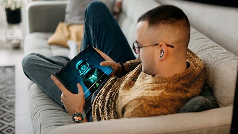 This exclusive T-Mobile deal gets you a powerful Samsung tablet for only $99 — but you’re running out of time Person using Galaxy Tab S10 FE on couch